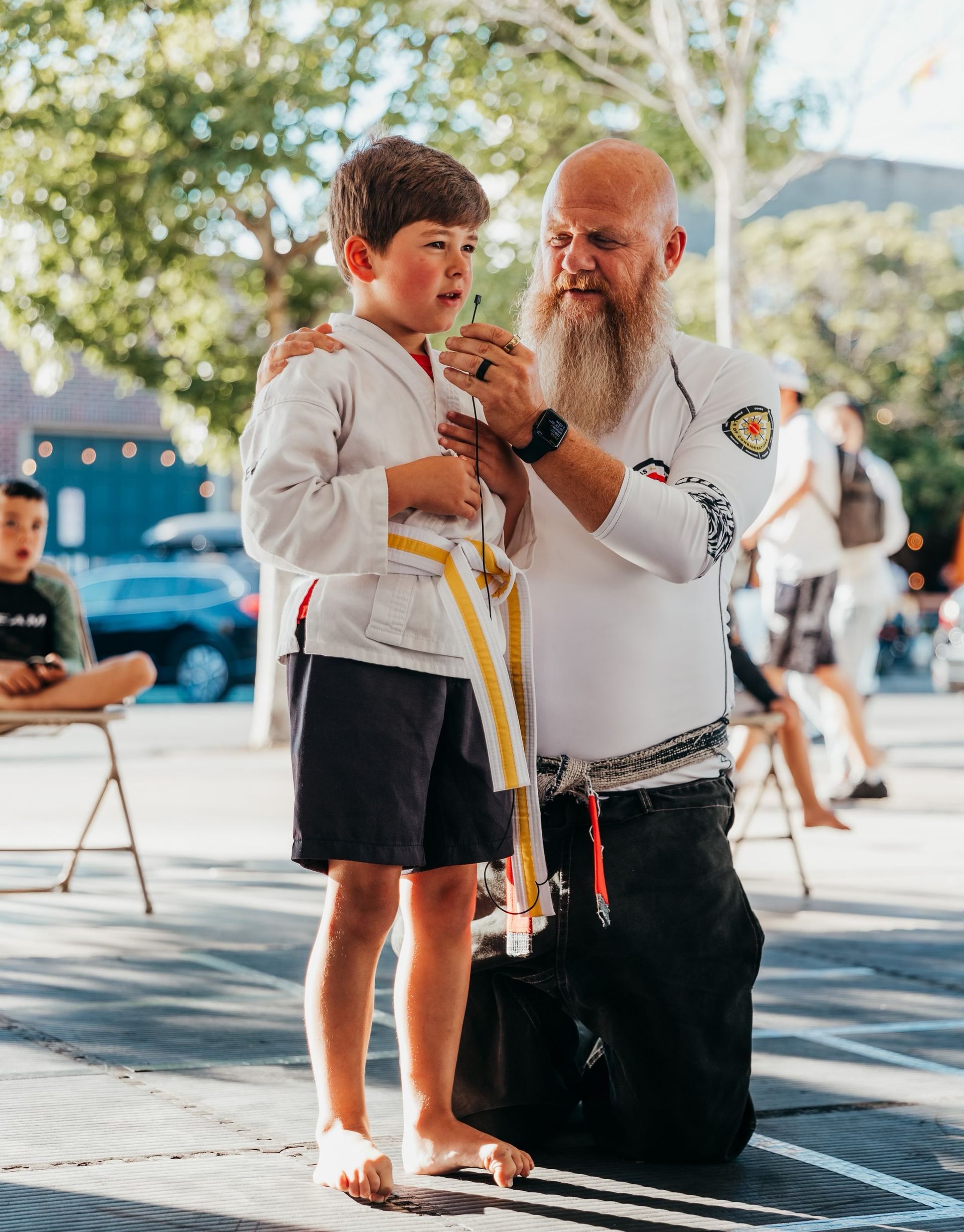 proud teenager receiving award from martial arts class