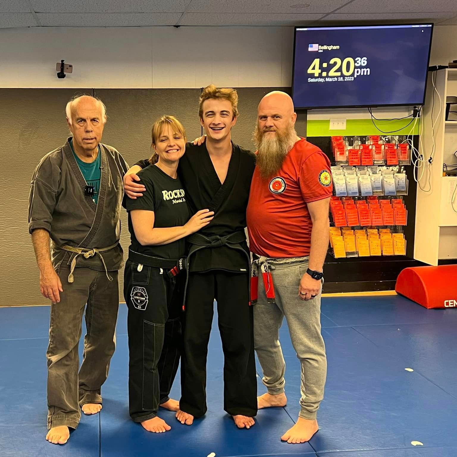 exhausted but happy students post a high-intensity self-defense class