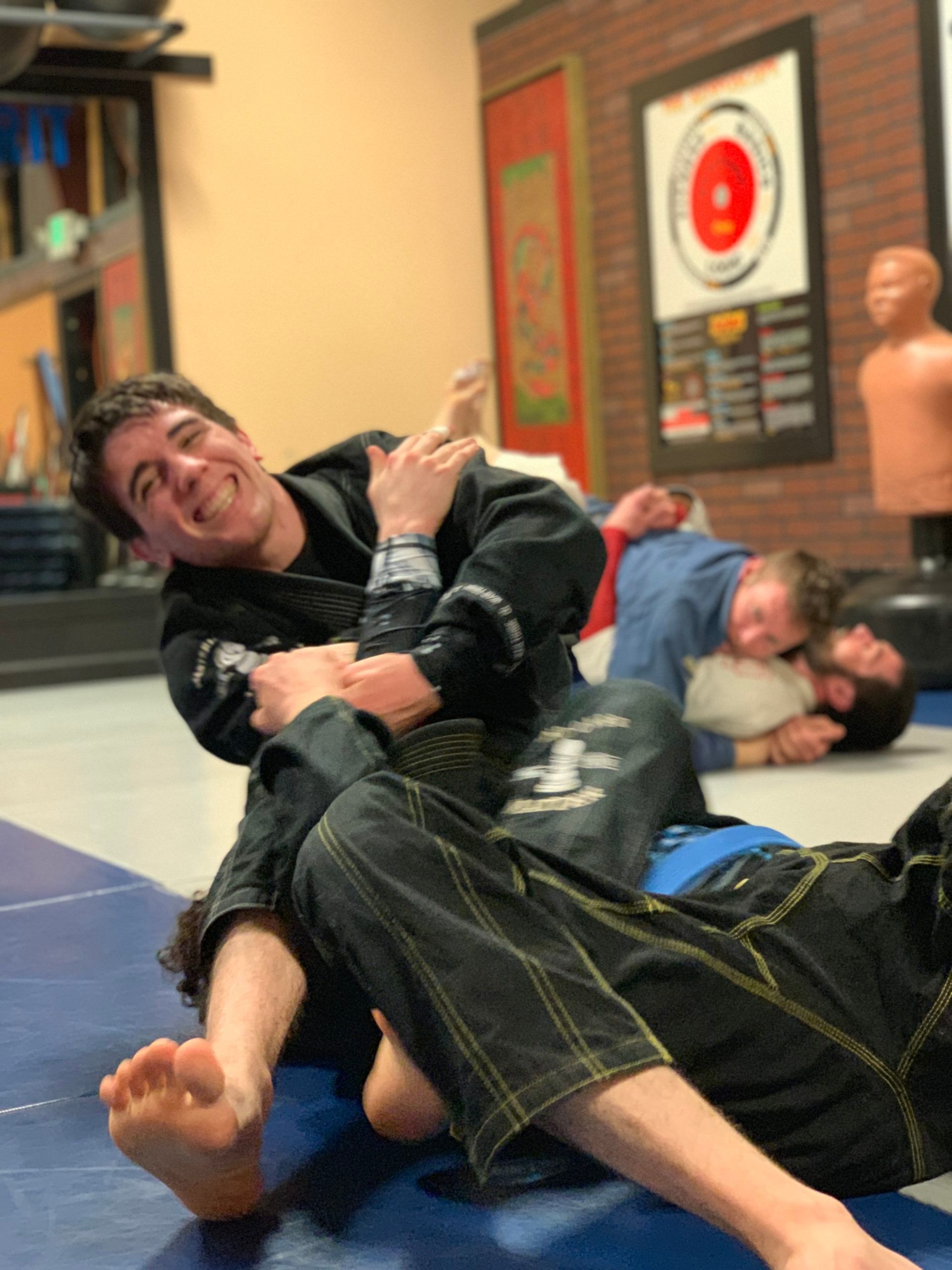 students learning a self-defense move