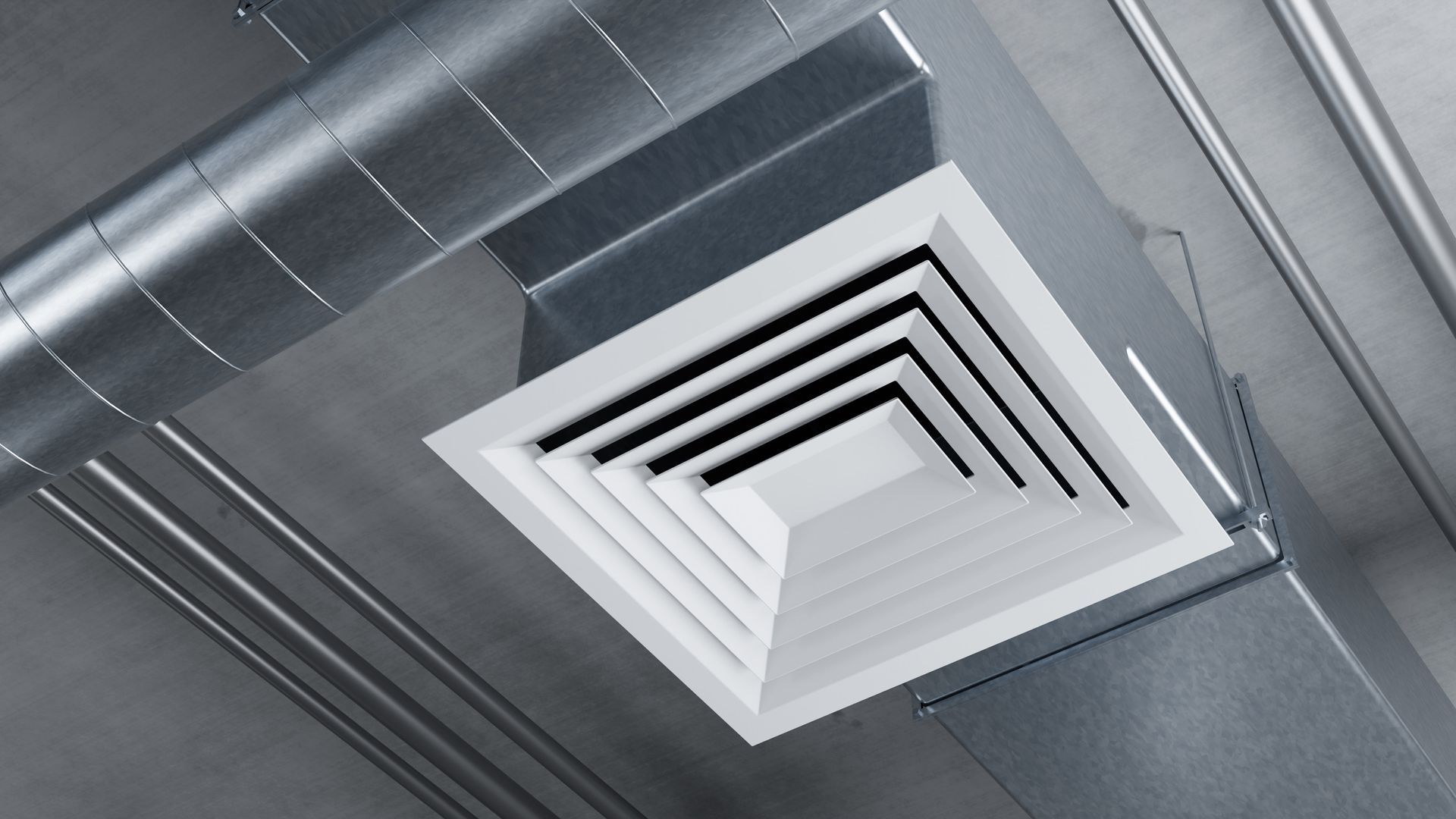 White ceiling air vent on a gray industrial ceiling with exposed ducts White ceiling air vent on a gray industrial ceiling with exposed ducts