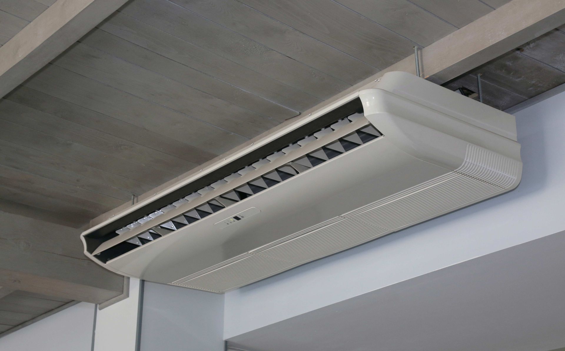 Ceiling-mounted air conditioner unit under a concrete ceiling. Ceiling-mounted air conditioner unit under a concrete ceiling.