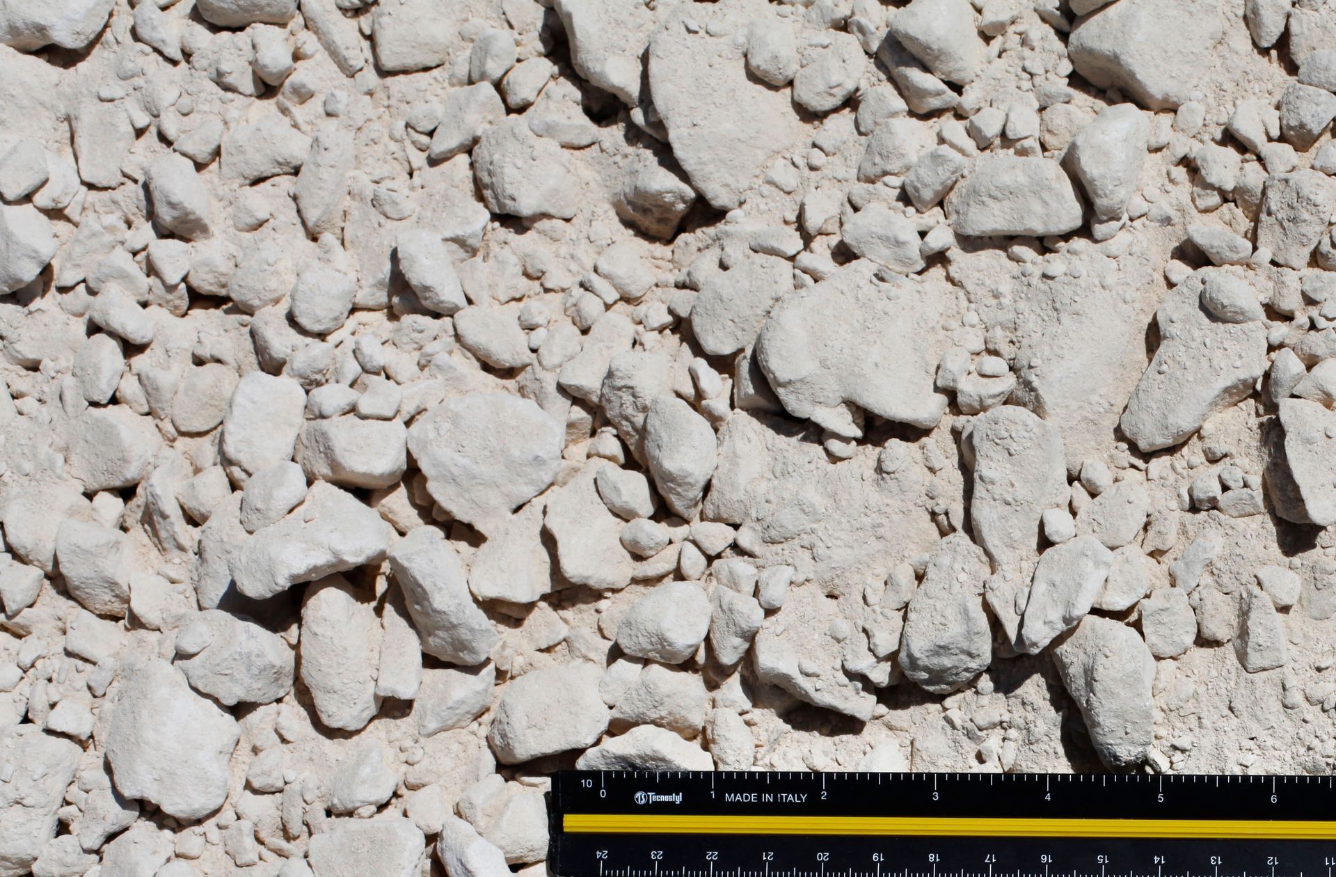 A ruler is next to a pile of rocks