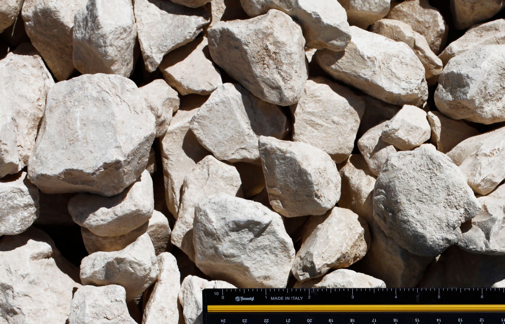 A ruler is next to a pile of rocks