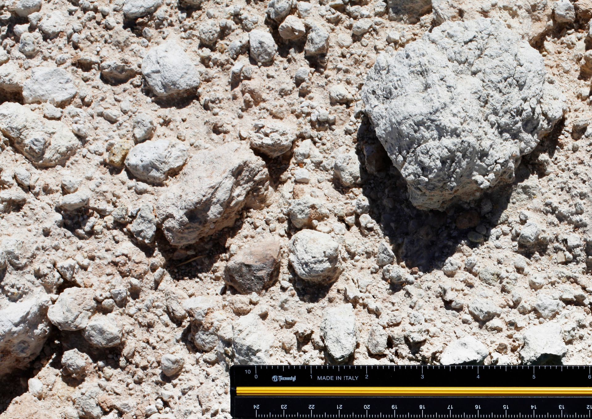 A ruler is next to a pile of rocks