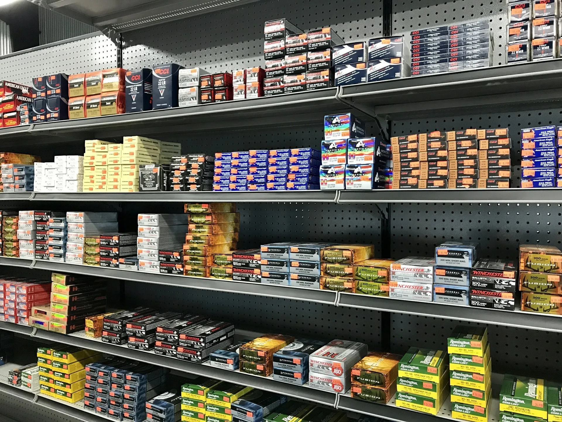 Shelves filled with various boxes of merchandise in a store.