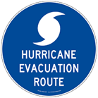 Blue circular sign with white hurricane symbol and