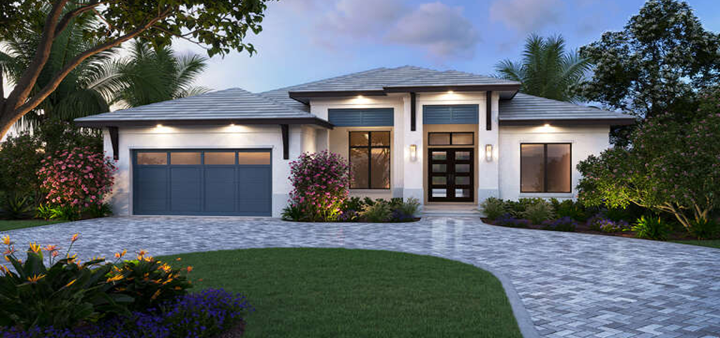 Exterior of a modern house at dusk, with gray stone driveway, green grass, and lush landscaping.