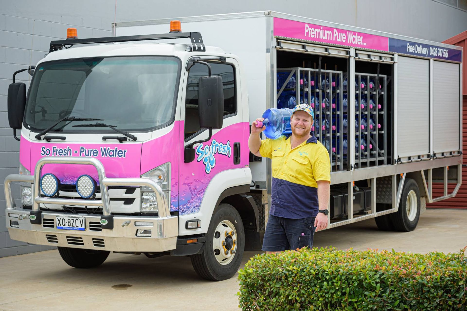 Pink-and-white Delivery Truck With Open Side Racks — So Fresh Wide Bay in Childers, QLD