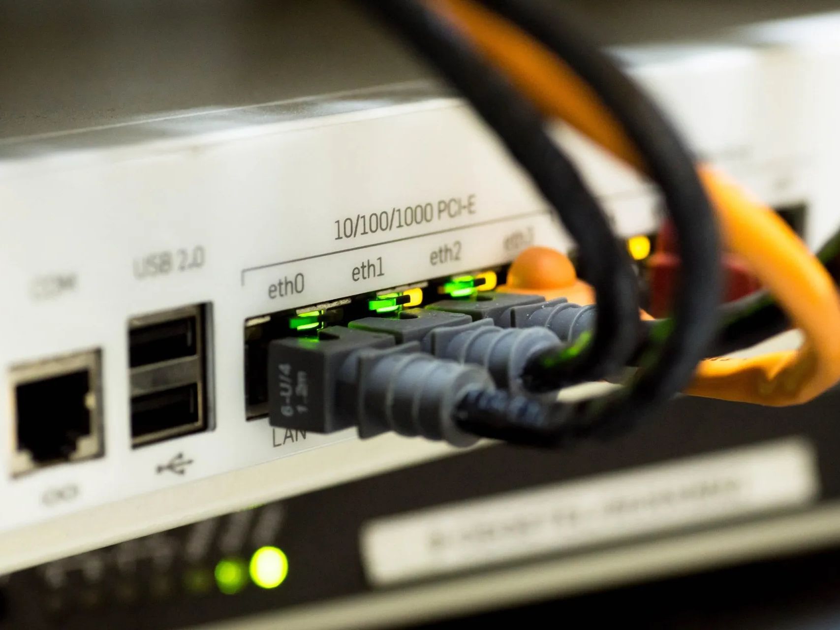 A bunch of wires are plugged into a computer