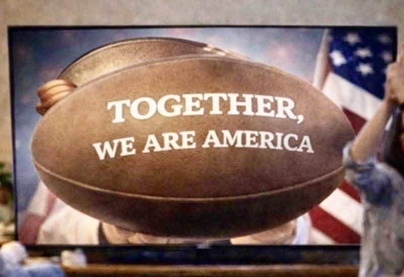 A football displays the text