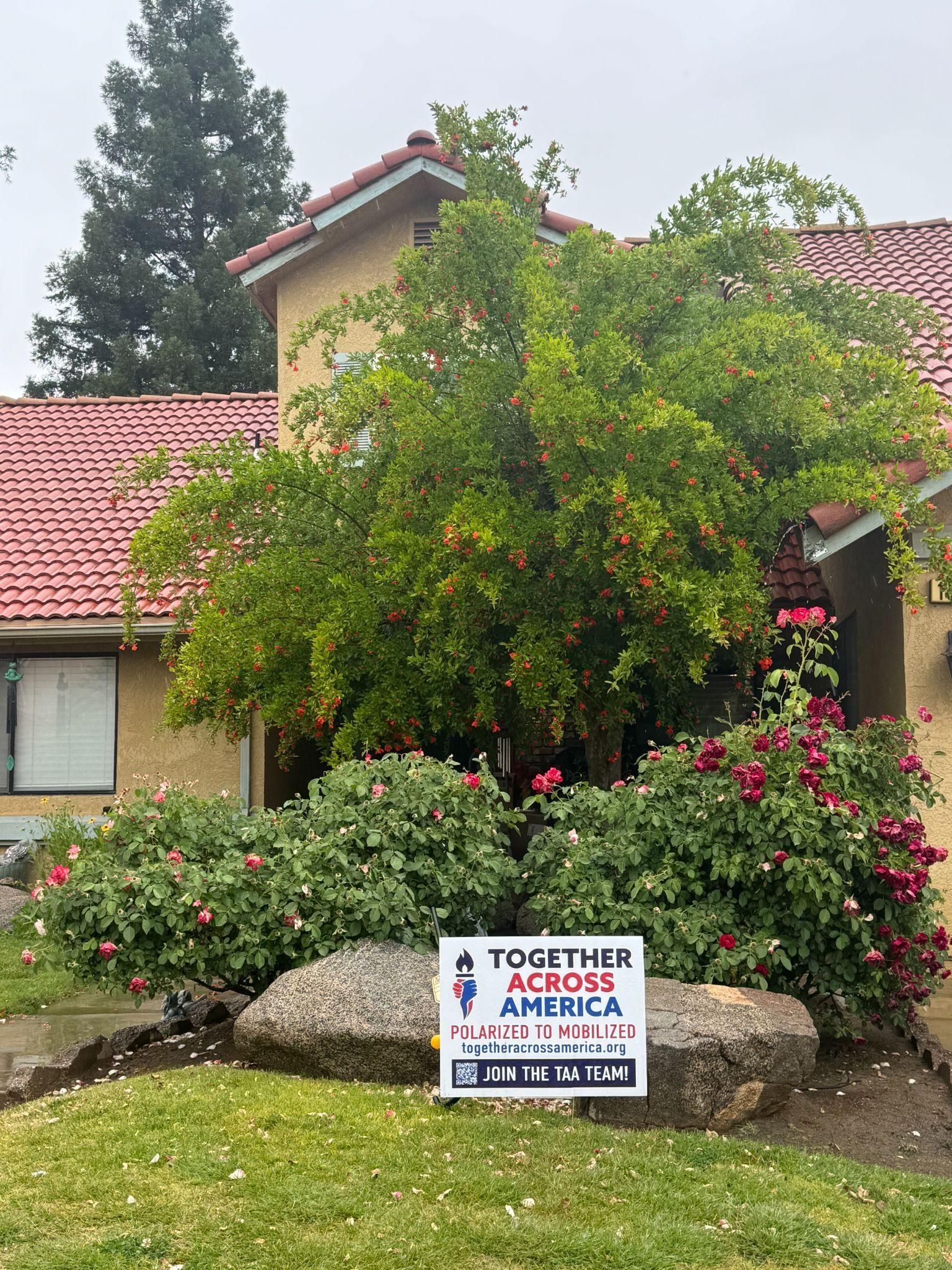 A yard sign reading