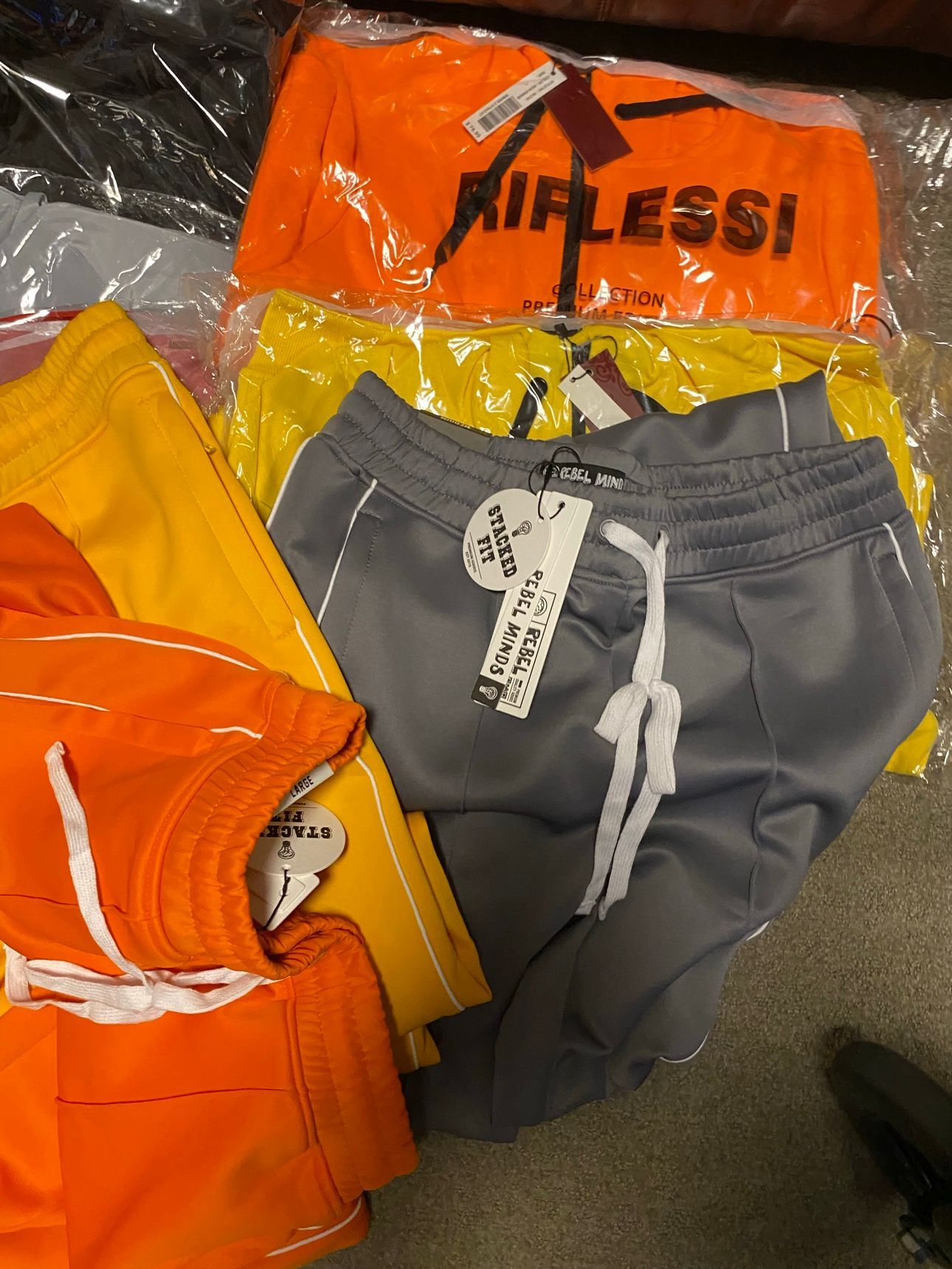 Sweatsuits — orange, yellow, grey