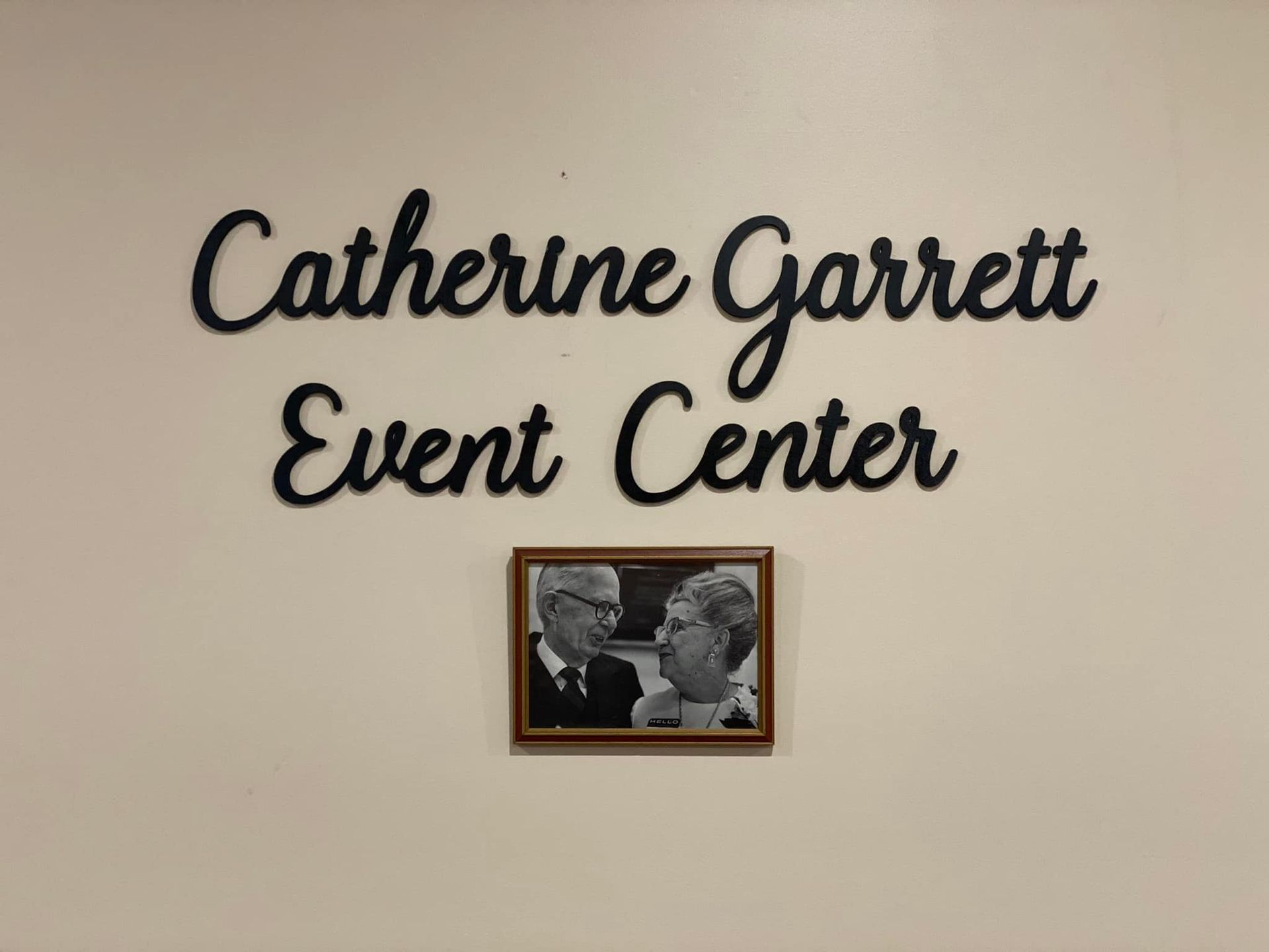 A sign on a wall that says catherine garrett event center