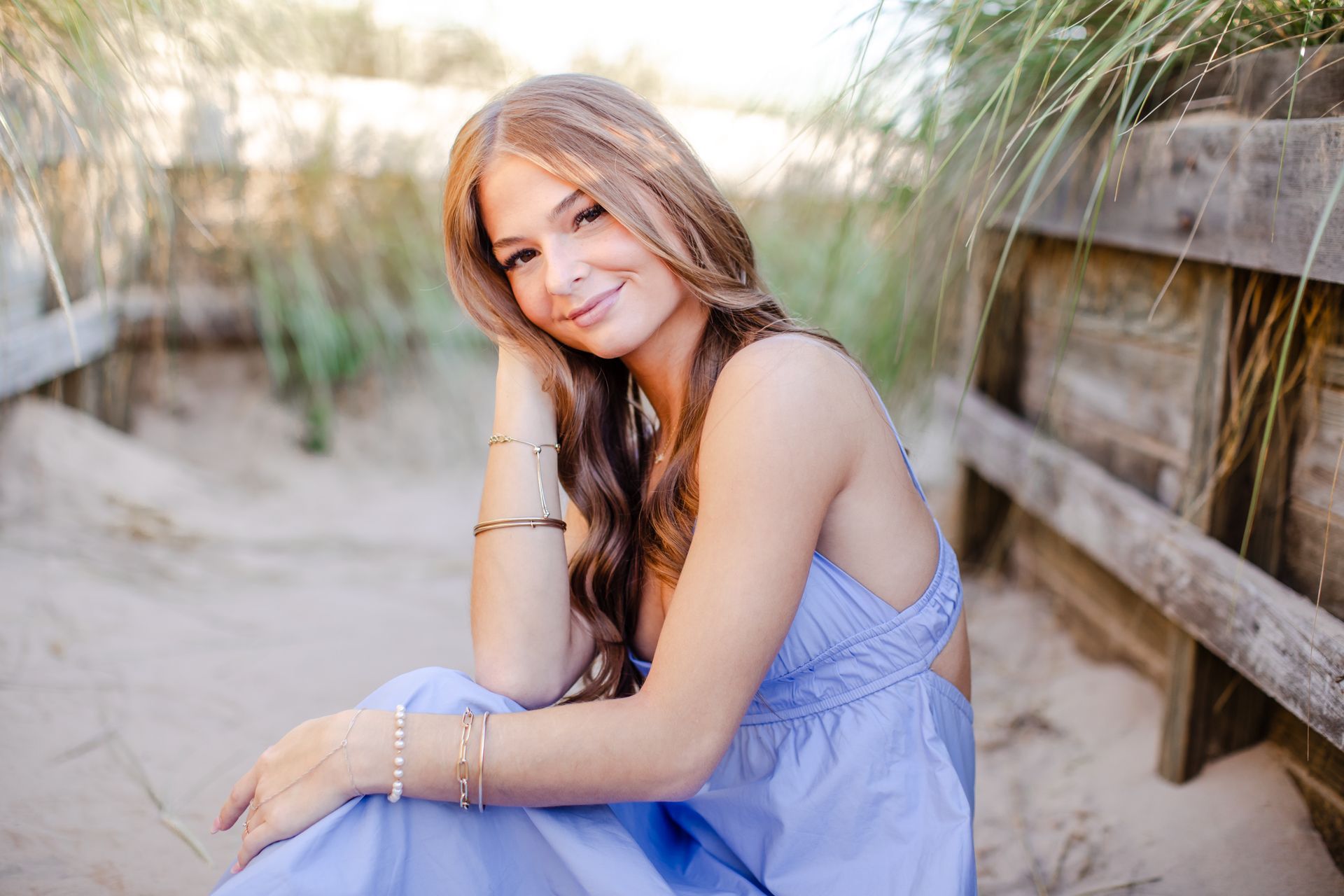 High School Senior girl at west michigan lakeshore beach sand.