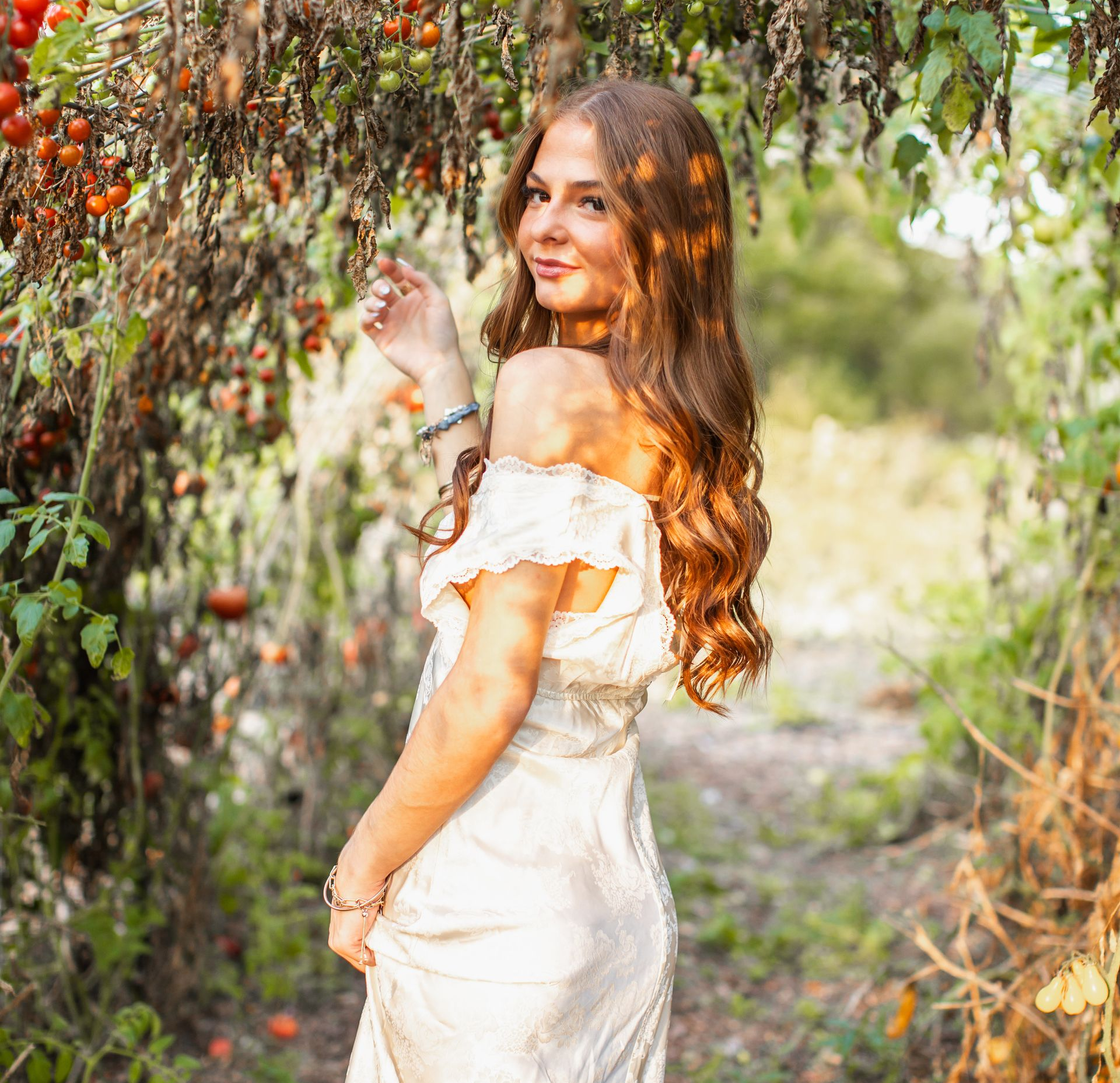 High school senior girl in garden.