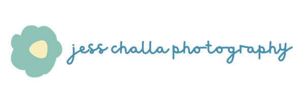 Logo for Jess Challa Photography featuring a light blue flower icon with a cream center next to handwritten blue text.