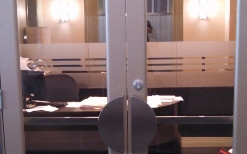 A door that has a round handle on it