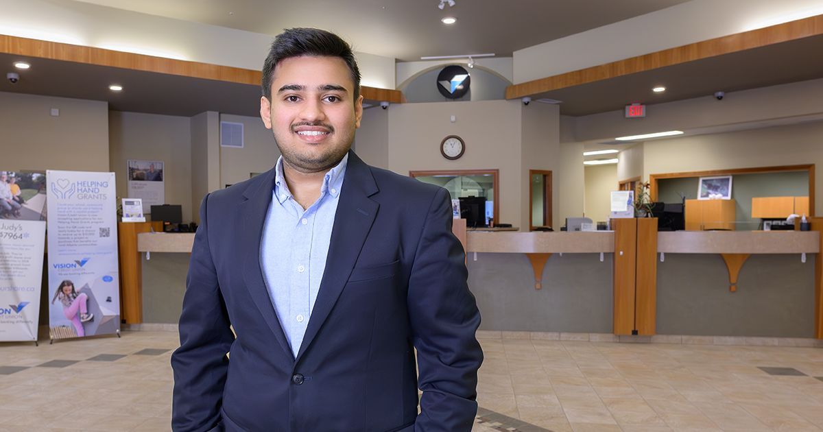 Shrey Kothari, Vision Credit Union Investment Specialist, poses at the Camrose City Centre branch.