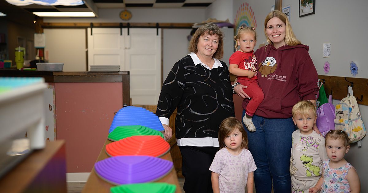 Barb and Amanda with preschool children at the Eagle's Nest Out of School Care Society in Edgerton.