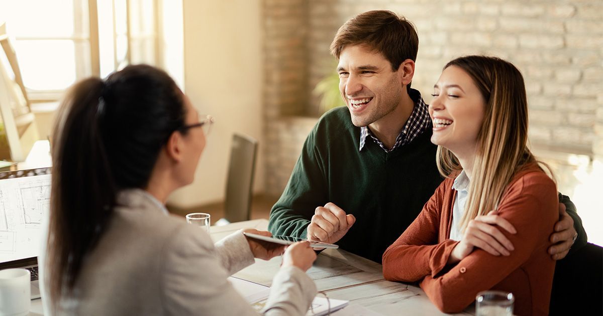 Young couple applying for a mortgage.