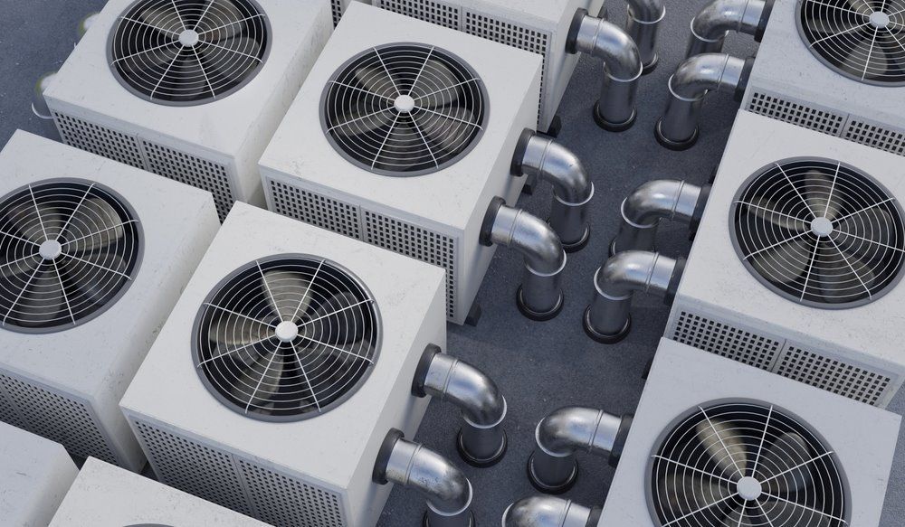 A Bunch of Air Conditioners Are Stacked on Top of Each Other —​ Centre Evap & Home Maintenance Services in Ciccone, NT