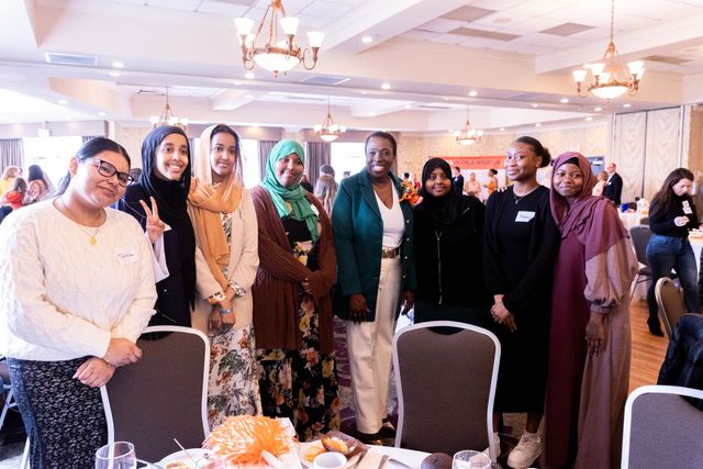 Photo of Dr. Judi with seven women at the Maine YWCA women of note conference