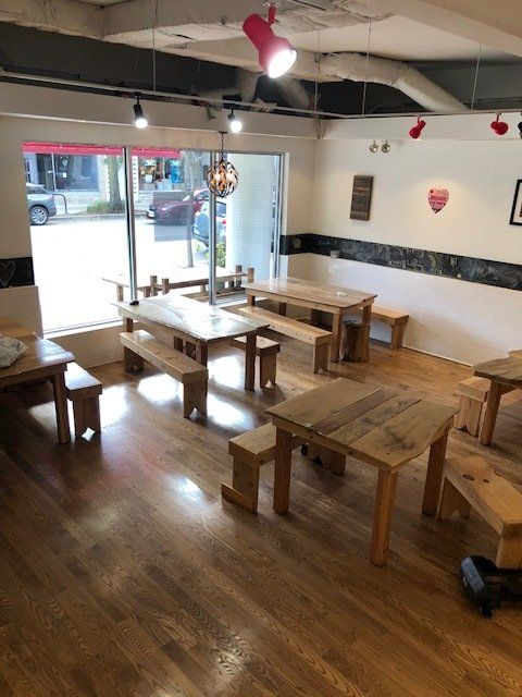 2901 Central restaurant space with counter, ceiling fan, and tables and benches for example purposes.