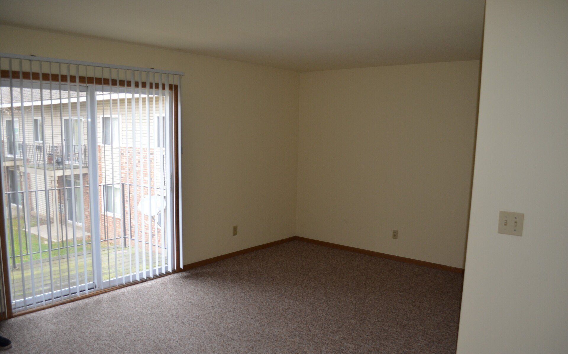 Living room with patio sliding door.