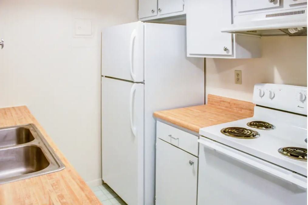Kitchen with stove and refrigerator