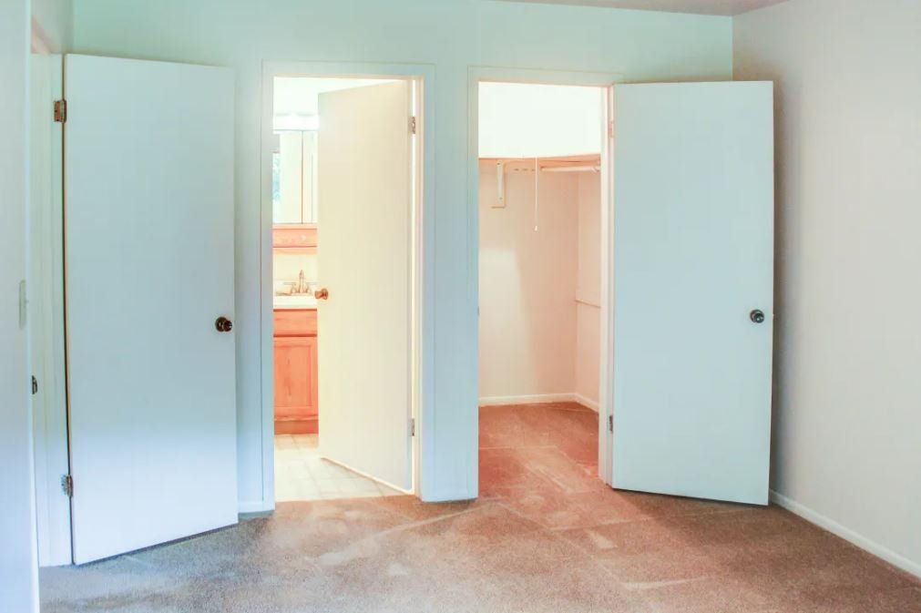 Bedroom with bathroom and closet