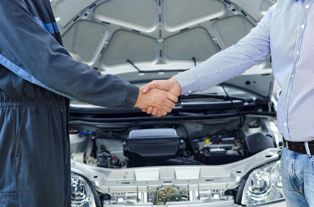 Car on Lift in a Repair Garage — Eugene, OR — C & L Automotive Car on Lift in a Repair Garage — Eugene, OR — C & L Automotive