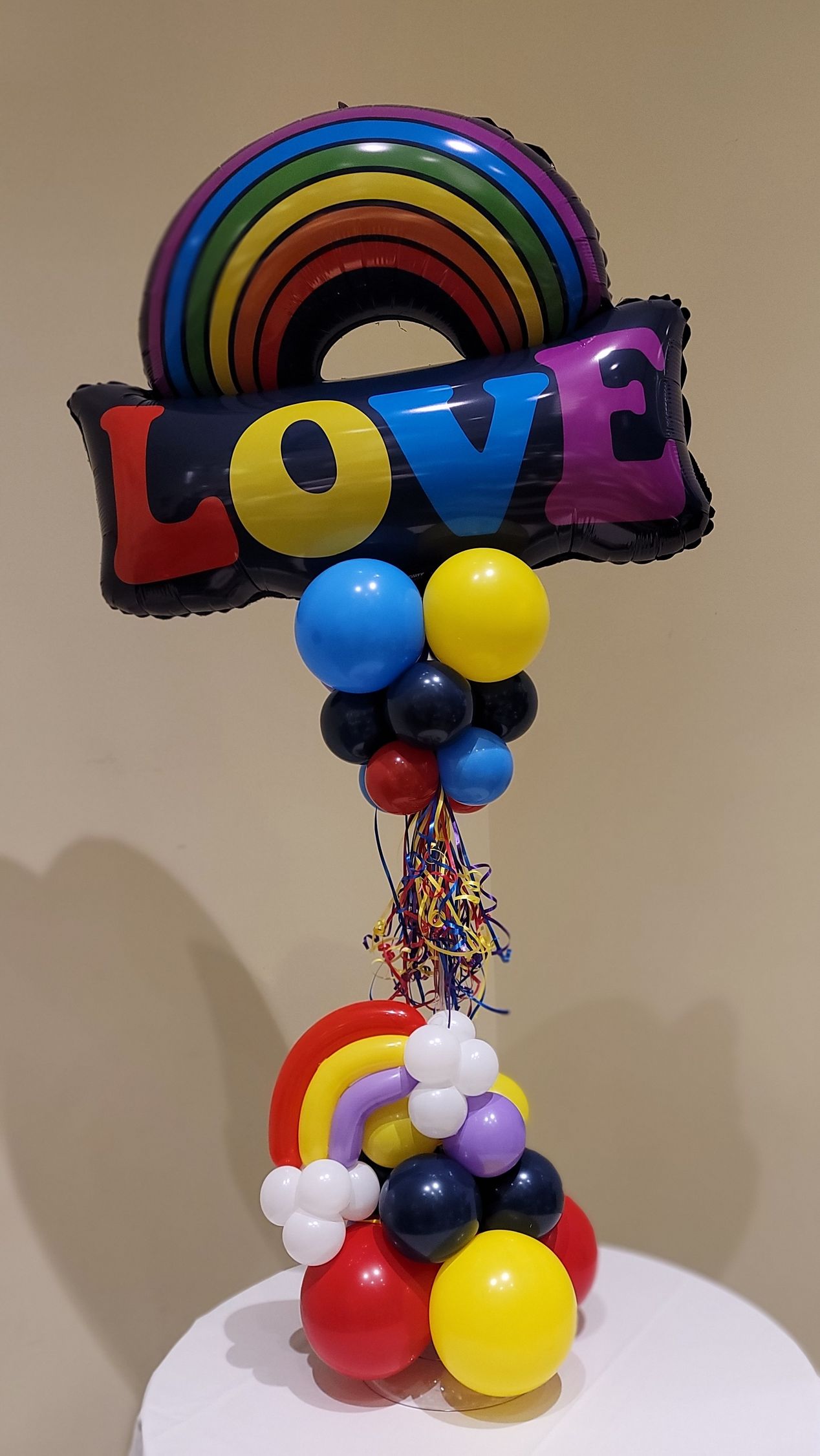 a balloon with a rainbow and the word love on it