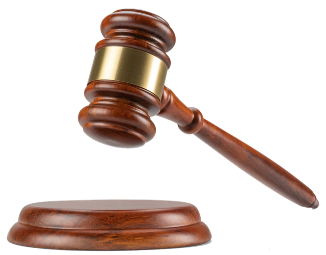 A wooden judge's gavel is sitting on a wooden base