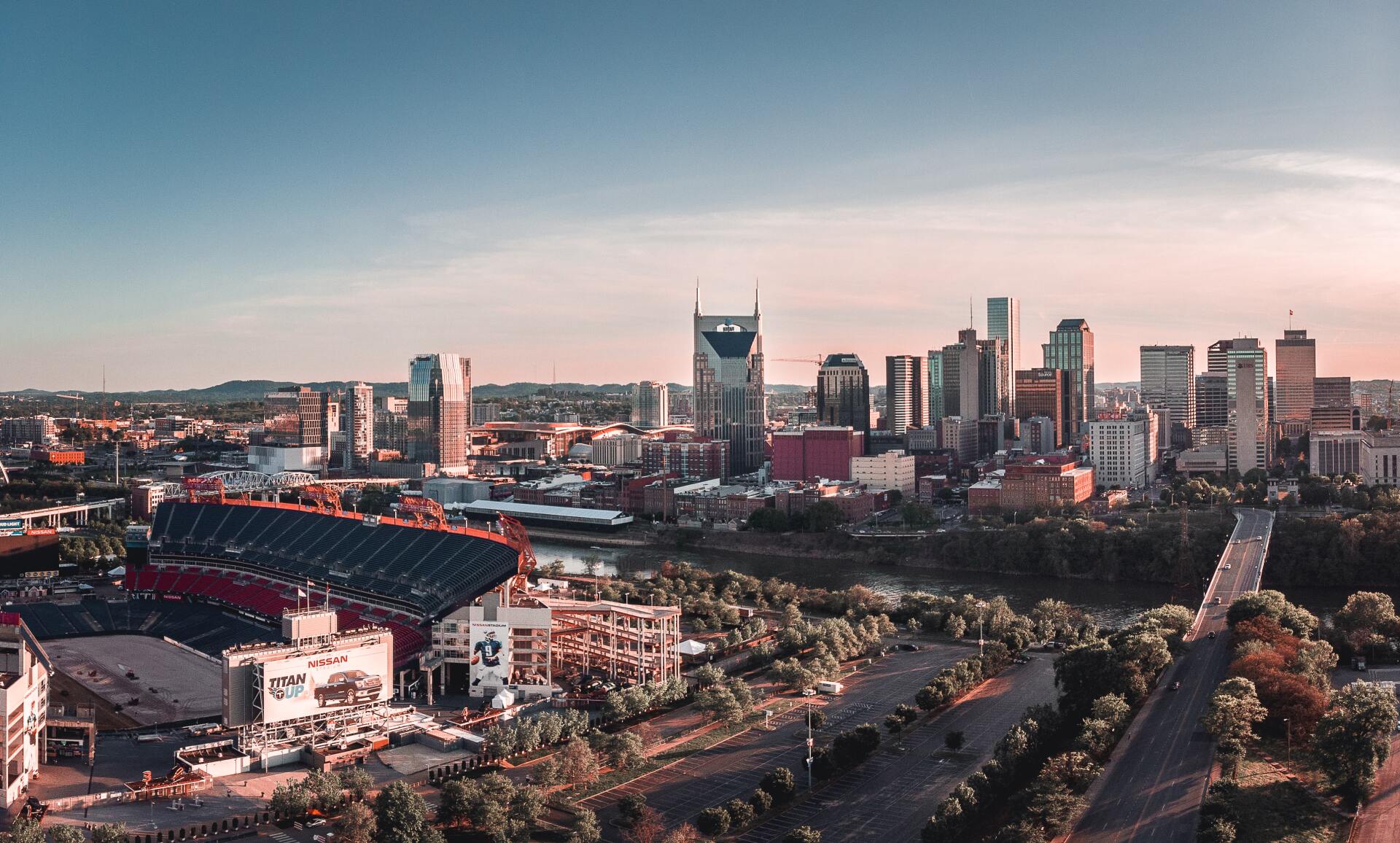 An aerial view of the city skyline at sunset.
