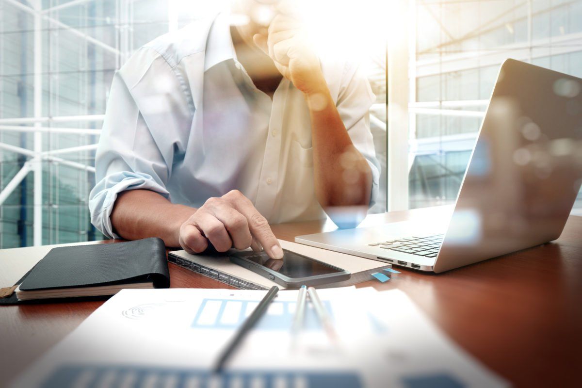 Photo of a man browsing his computer for content marketing