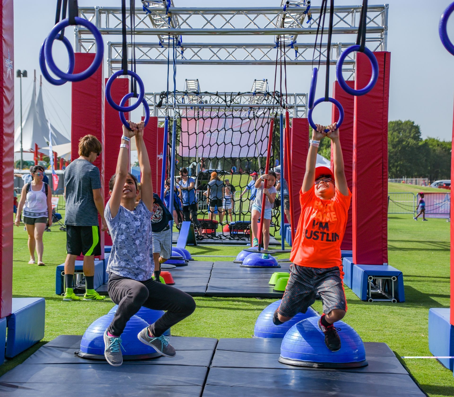 Kids completing Mobile Ninja Course at school field day