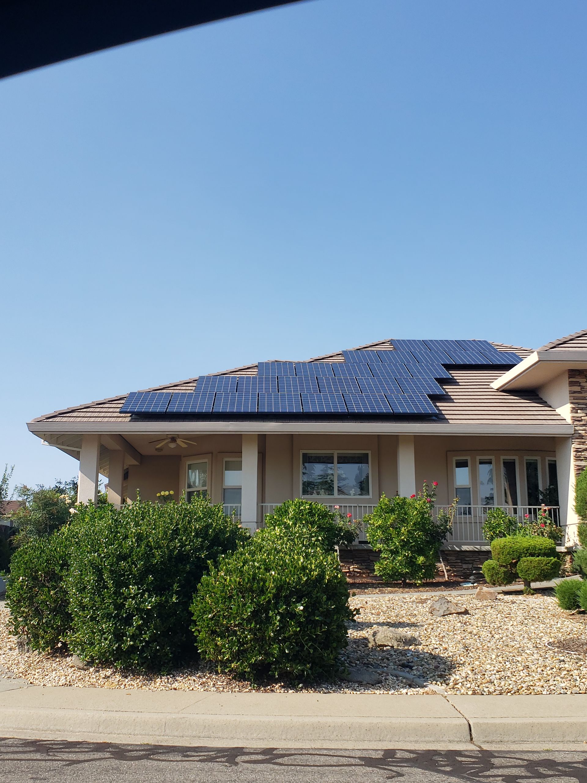 Home containing solar panels on the front left roof area