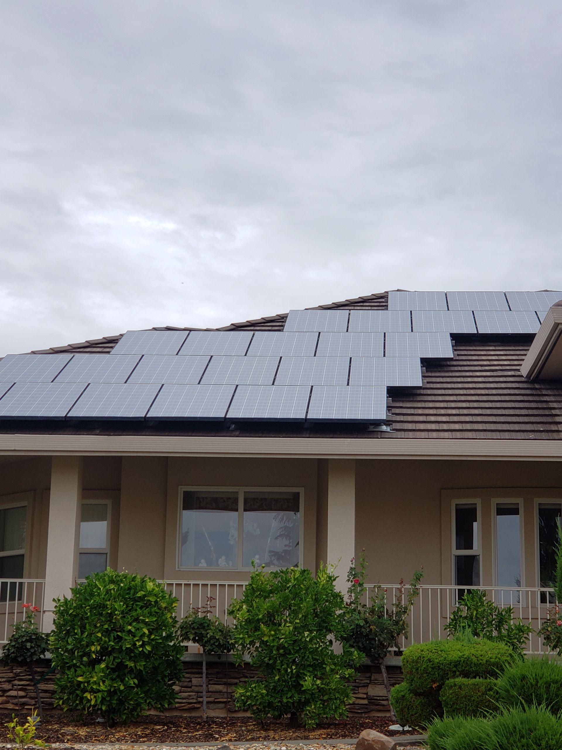 Grey skies over a home with solar panels