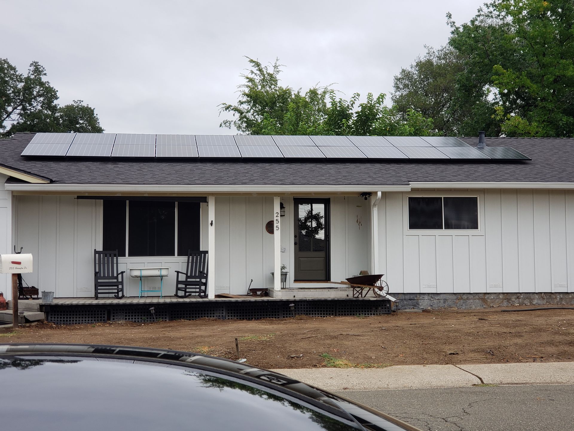 Single store home with solar panels across the roofline