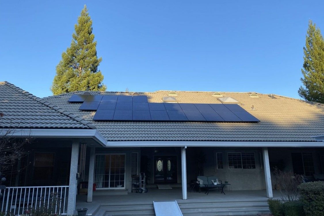 Awning of the home has solar panels on it
