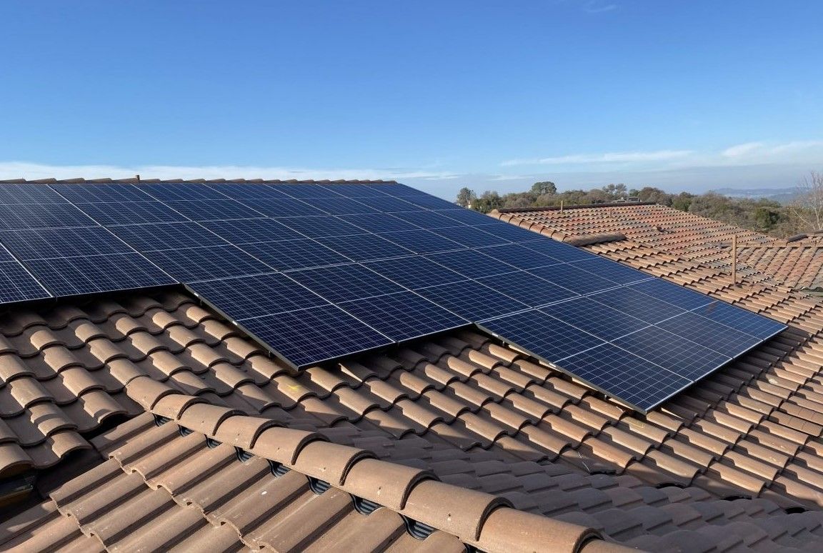 Spanish tiles with a solar array placed safely on top