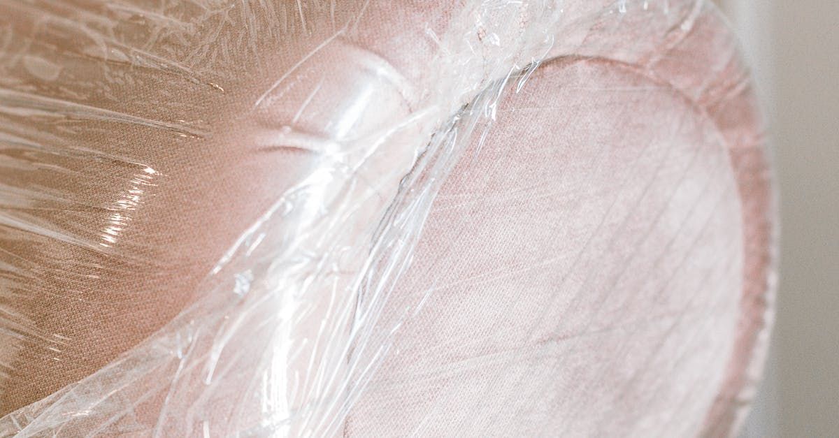 a piano is wrapped in plastic wrap in a room