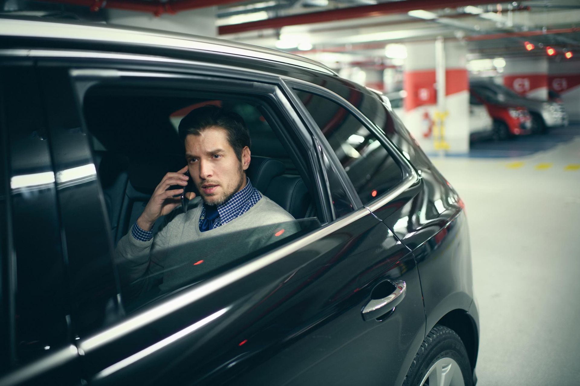 Man In Car Calling — Louisville, KY — Ambassador Capital Limousine Man In Car Calling — Louisville, KY — Ambassador Capital Limousine
