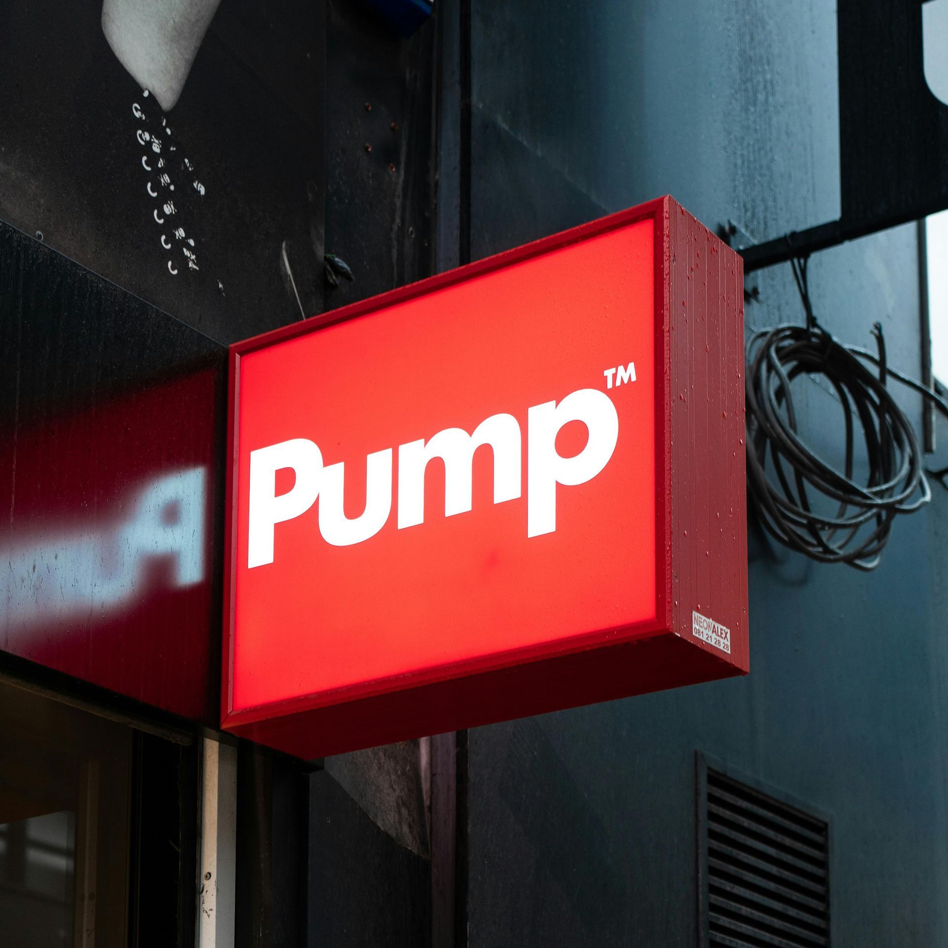 Red illuminated sign with the word