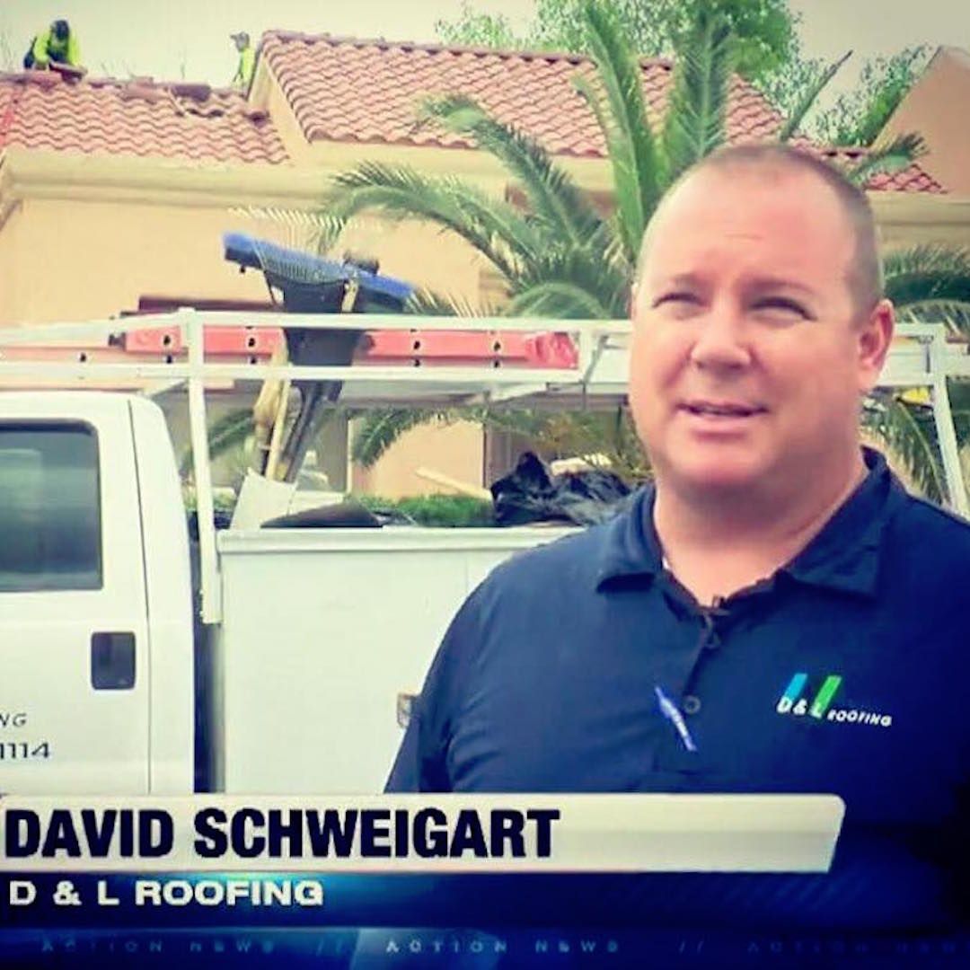 David schweigart is standing in front of a white truck