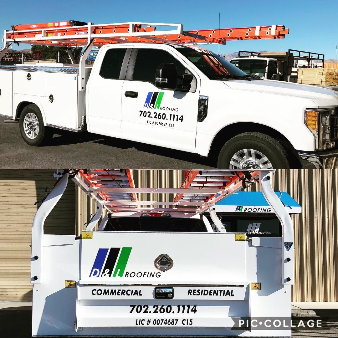 A white truck with a ladder on top of it.