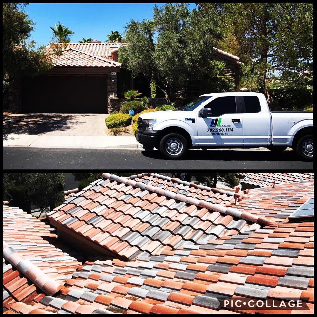 A white truck is parked in front of a house