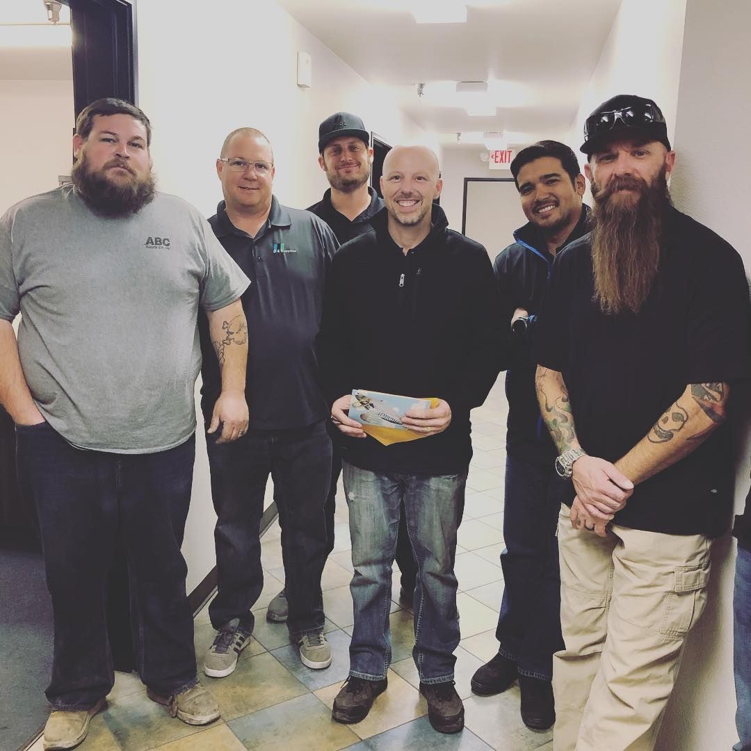 A group of men posing for a picture