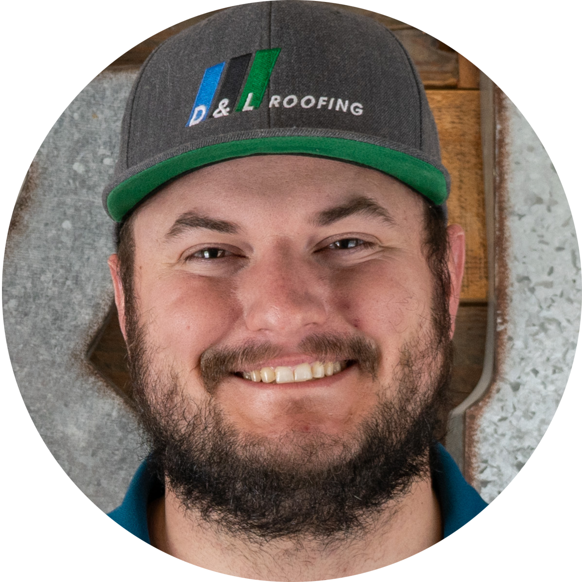 A man with a beard wearing a hat that says d & l roofing