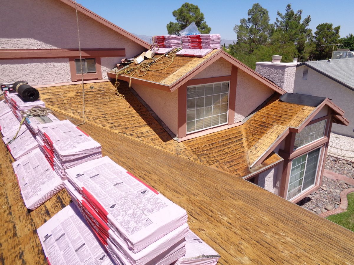 A house with a roof that is being repaired